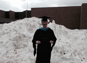 Brian Price with his diploma in snowy Northern Michigan.